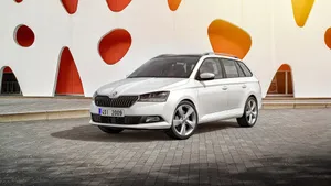 Stunning Silver Škoda Fabia Parked Against An Urban Background Wallpaper