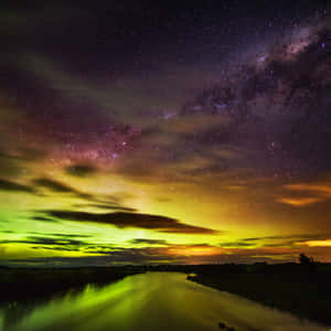 Stunning Southern Lights Illuminating The Night Sky Wallpaper