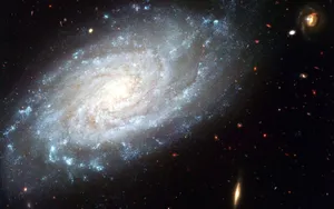 Stunning Spiral Galaxy In The Depths Of The Universe Wallpaper