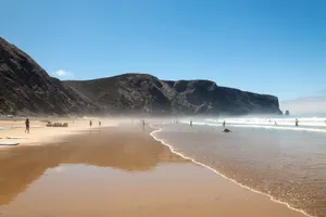 Stunning Sunset At A Tranquil Portuguese Beach Wallpaper