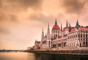 Stunning Sunset At Hungarian Parliament Buildings Wallpaper