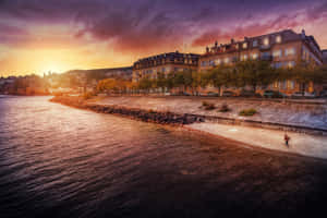 Stunning Sunset Over Lake Neuchâtel, Switzerland Wallpaper