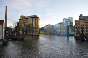 Stunning Sunset Over Norrköping's Iconic Industrial Landscape Wallpaper
