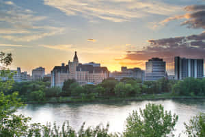 Stunning Sunset Over Saskatoon's Skyline Wallpaper