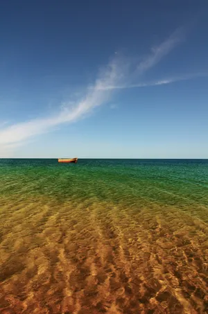 Stunning Sunset Over The Ocean Beach Wallpaper