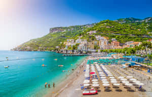 Stunning View Of A Sunlit Italian Beach Wallpaper