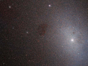 Stunning View Of Elliptical Galaxy In Outer Space Wallpaper