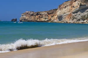 Stunning View Of The Beautiful Portuguese Beach Wallpaper