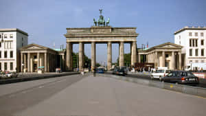 Stunning View Of The Brandenburg Gate Against A Clear Blue Sky Wallpaper