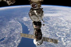 Stunning View Of The International Space Station Orbiting Earth Wallpaper