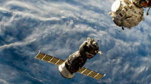 Stunning View Of The International Space Station Orbiting Earth Wallpaper