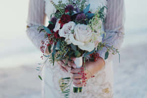 Stunning Wedding Bouquet In The Hands Of A Beautiful Bride Wallpaper