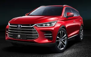 Stunning White Byd Electric Vehicle In Nature Wallpaper