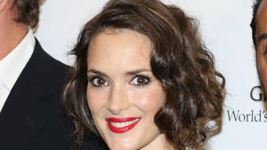 Stunning Winona Ryder Sporting Red Lipstick And A Curly Short Hairdo Wallpaper