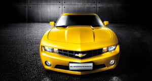 Stunning Yellow Car Parked On The Road Wallpaper