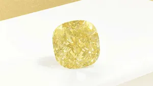 Stunning Yellow Diamond Illuminating The Background Wallpaper