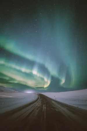 Stunningly Beautiful Snowy Road Northern Lights Wallpaper