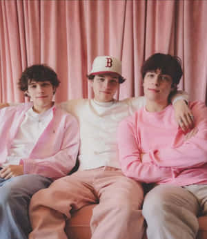Sturniolo_ Triplets_ Pink_ Backdrop_ Portrait Wallpaper