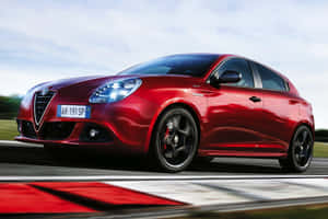 Stylish Alfa Romeo Giulietta In Motion On A Highway Wallpaper