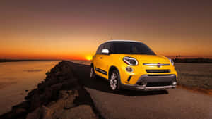 Stylish And Modern Fiat 500l On The Road Wallpaper