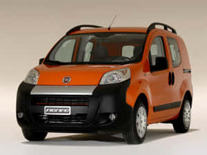 Stylish And Versatile Fiat Fiorino In Motion Wallpaper