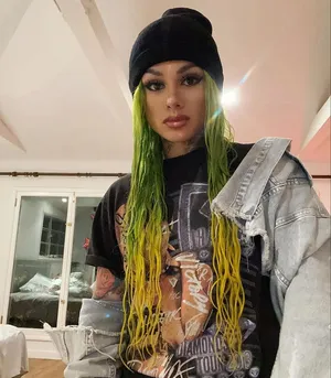 Stylish Artistwith Green Hair Wallpaper