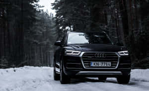 Stylish Audi Q5 In A Scenic Landscape Wallpaper