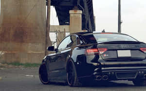 Stylish Audi S5 In Striking Outdoor Scene Wallpaper