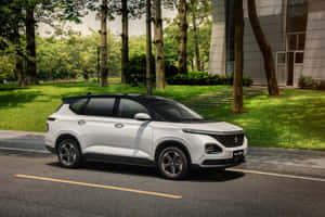 Stylish Baojun Vehicle On An Open Road Wallpaper