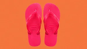 Stylish Beach Sandals On The Perfect Sandy Shore Wallpaper