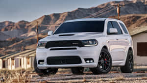 Stylish Black Dodge Durango Parked On The Mountain Road Wallpaper