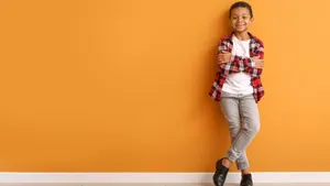 Stylish Boy On Orange Background Wallpaper