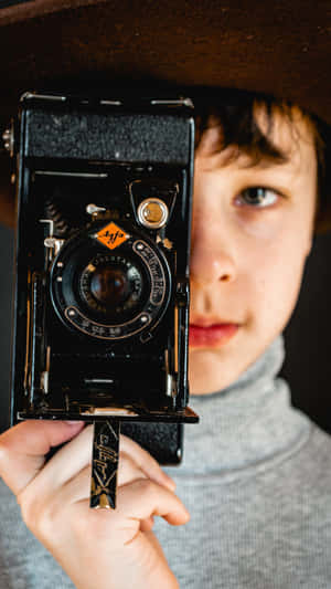 Stylish Boy With Retro Camera Wallpaper