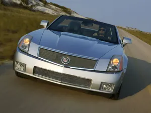 Stylish Cadillac Xlr Cruising On The Road Wallpaper