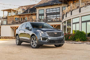 Stylish Cadillac Xt5 On Open Road Wallpaper