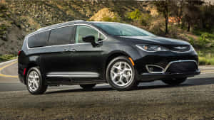 Stylish Chrysler Pacifica Cruising On The Open Road Wallpaper