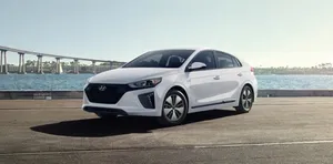 Stylish Compact Car On The Road Wallpaper