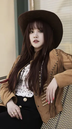 Stylish Cowgirl Outfit Portrait Wallpaper