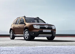 Stylish Dacia Vehicle In A Stunning Mountain Landscape Wallpaper
