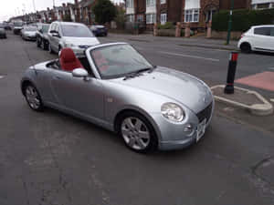 Stylish Daihatsu Copen On A Scenic Route Wallpaper