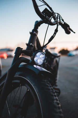 Stylish Electric Bike On City Street Wallpaper