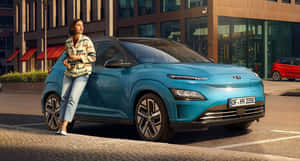 Stylish Electric Vehicle On The Road Wallpaper