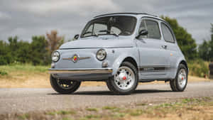 Stylish Fiat 500 In A Picturesque Urban Setting Wallpaper
