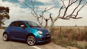 Stylish Fiat 500 In Action Wallpaper