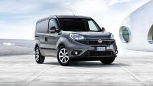 Stylish Fiat Doblo On City Streets Wallpaper