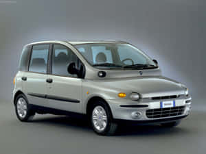 Stylish Fiat Multipla In Urban Landscape Wallpaper