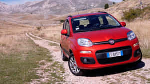 Stylish Fiat Panda In Action On City Streets Wallpaper