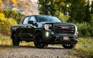 Stylish Gmc Sierra On A Scenic Background Wallpaper