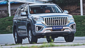 Stylish Haval Suv Cruising On An Open Road Wallpaper