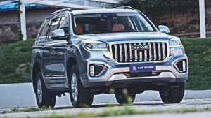 Stylish Haval Suv Cruising On An Open Road Wallpaper
